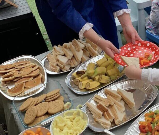 Children choosing from a food activity spread
