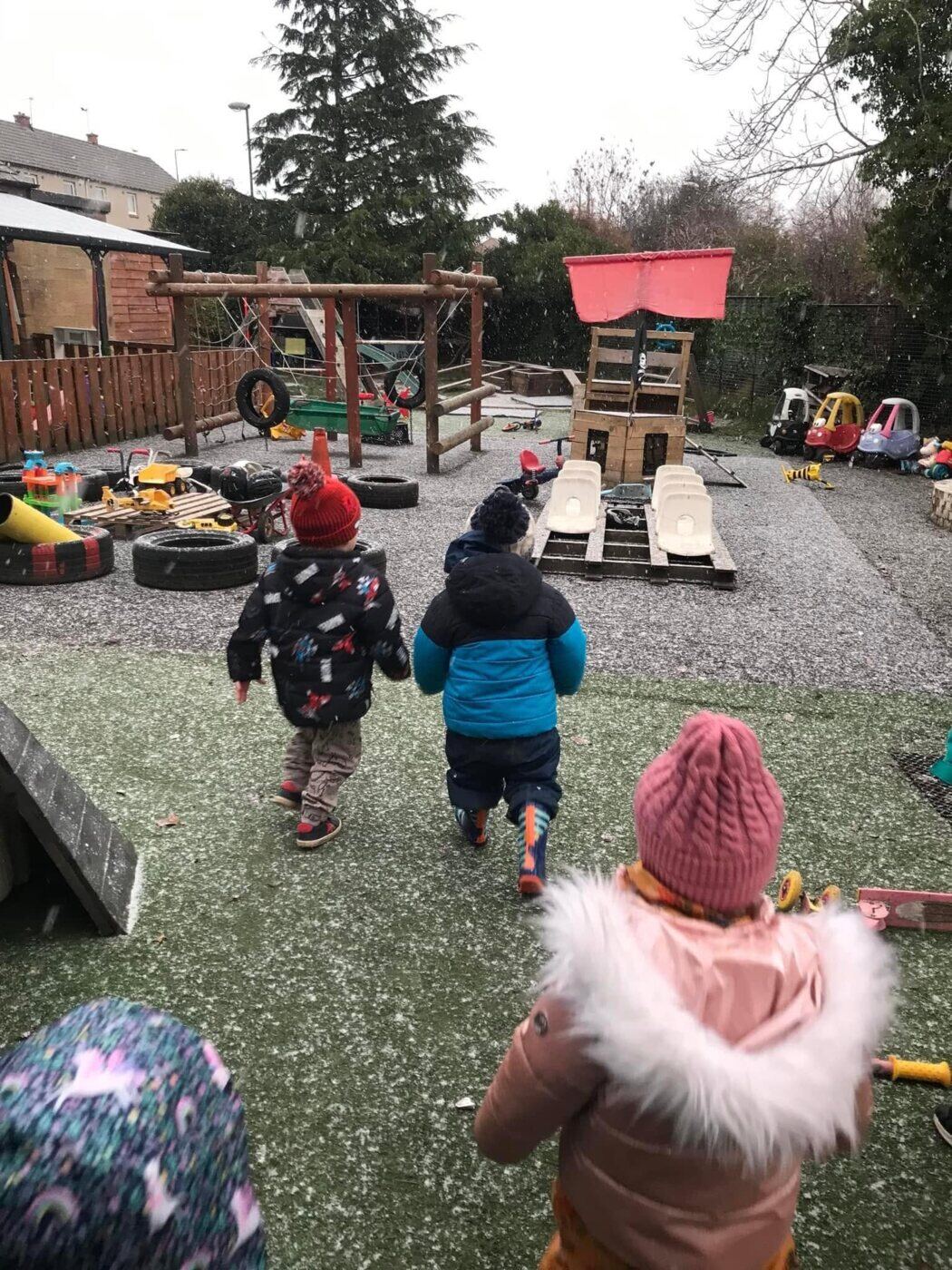 Children enjoying festive outdoor play at Bonnyrigg