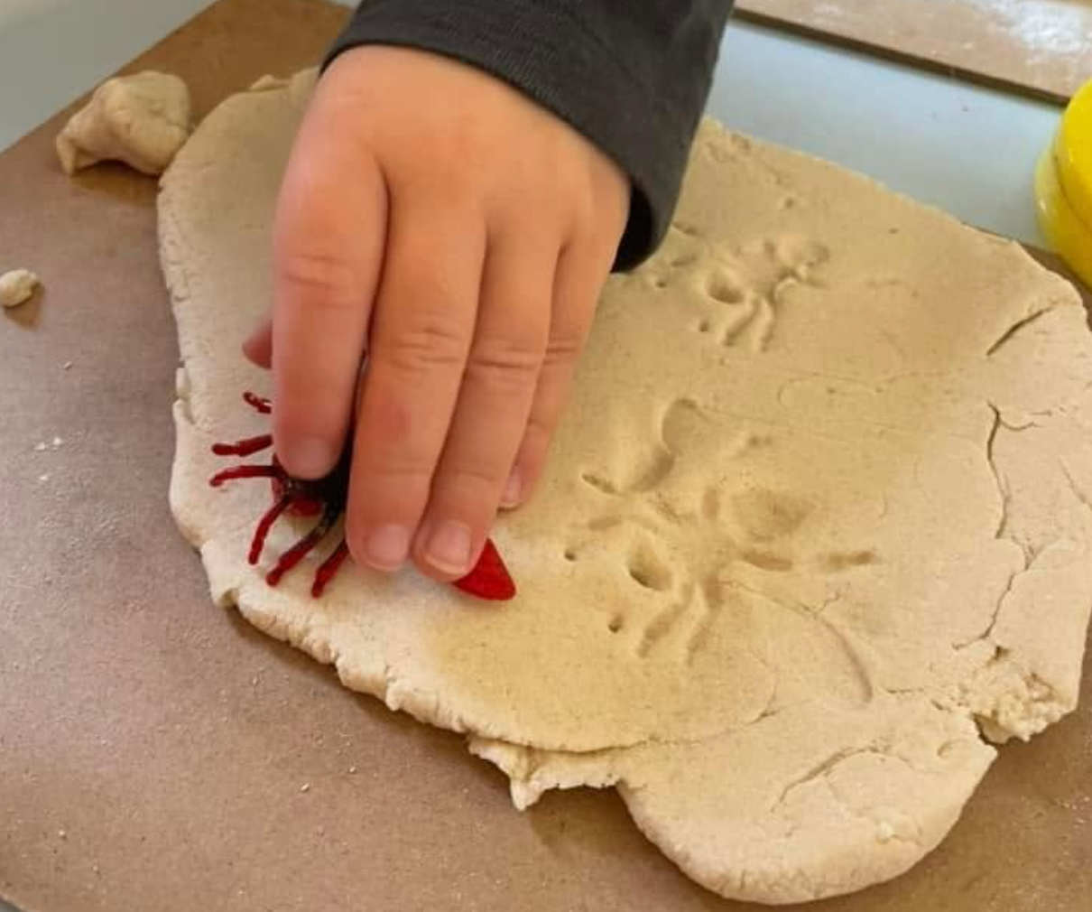 A child exploring clay and creative materials at Bonnyrigg