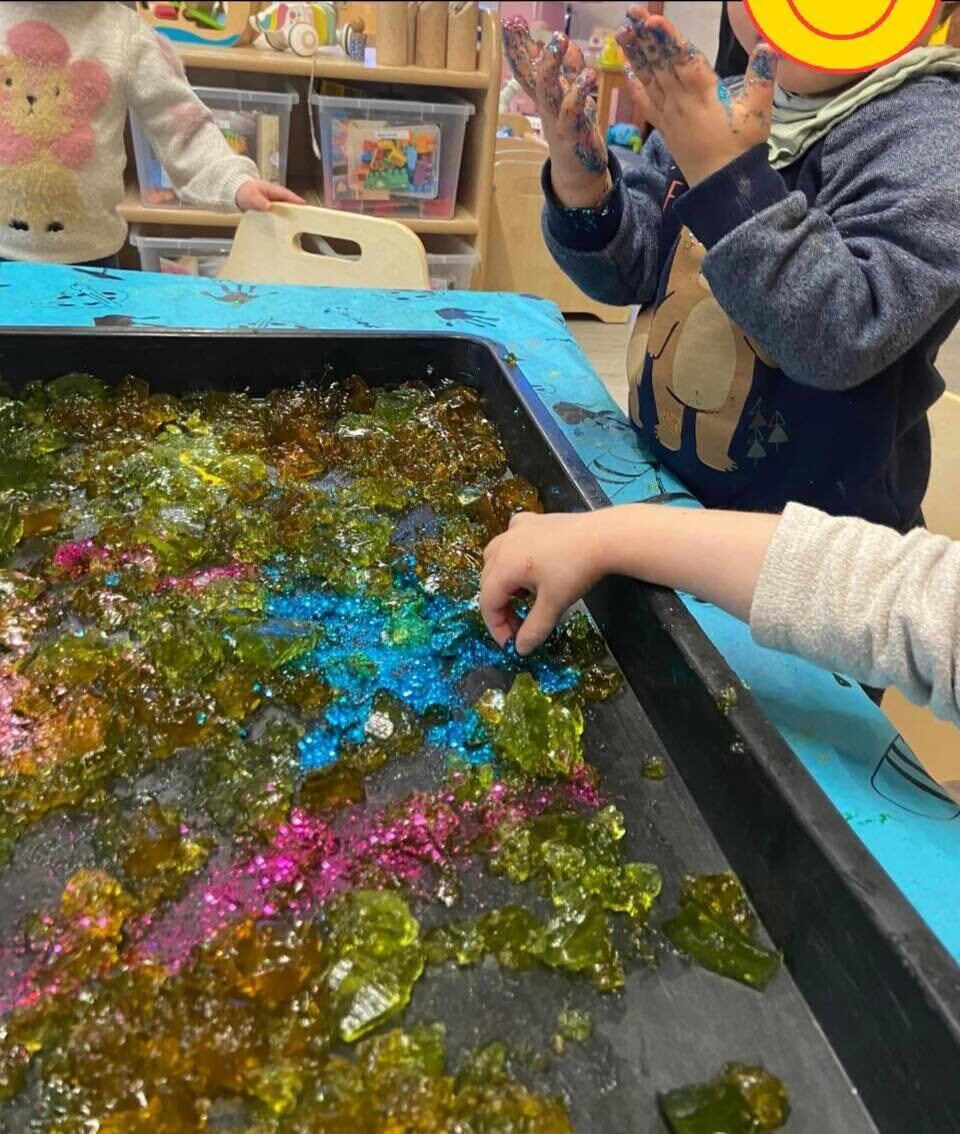 Children enjoying colourful creative sensory play