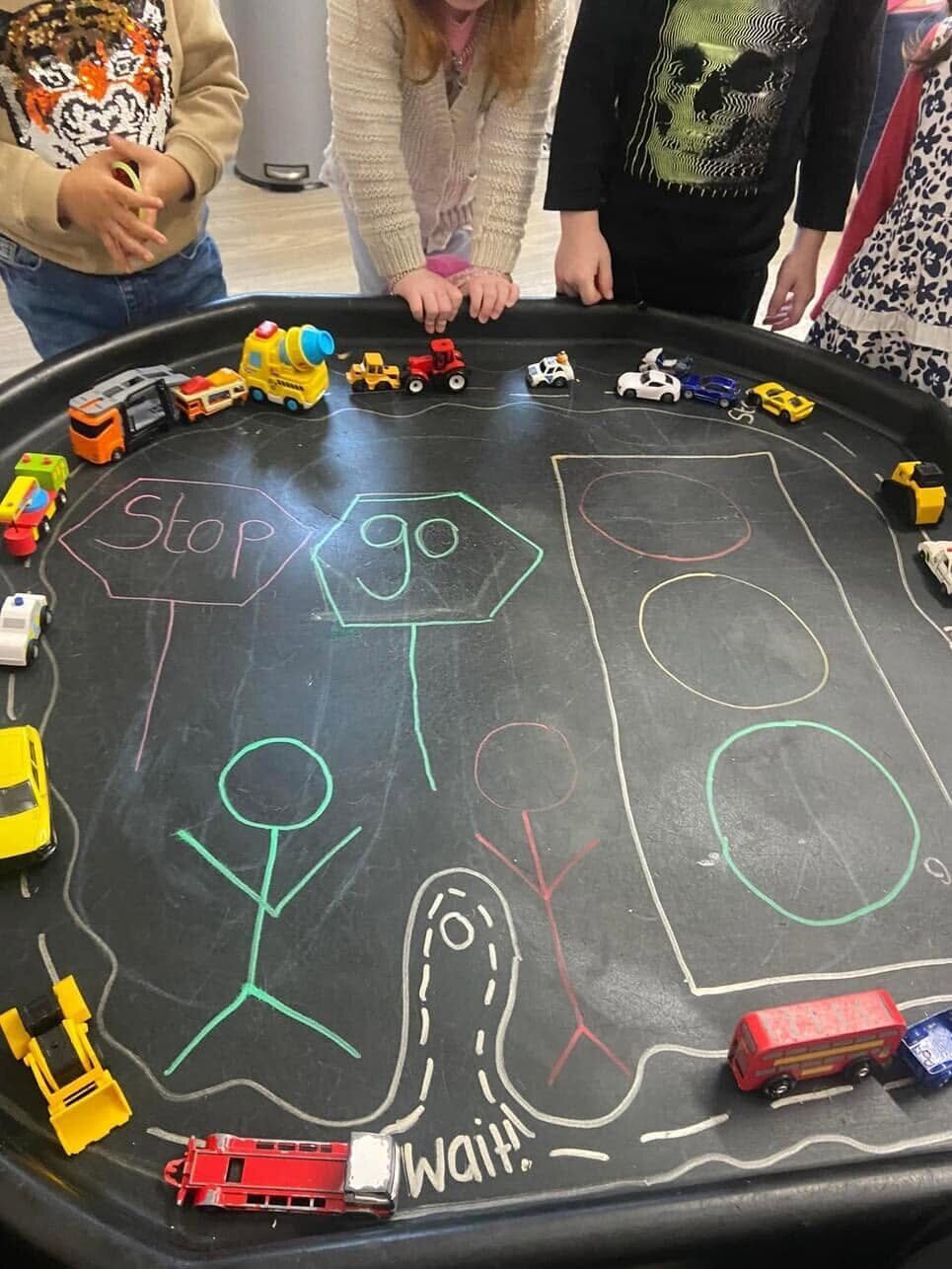 Children learning about road safety through imaginative play